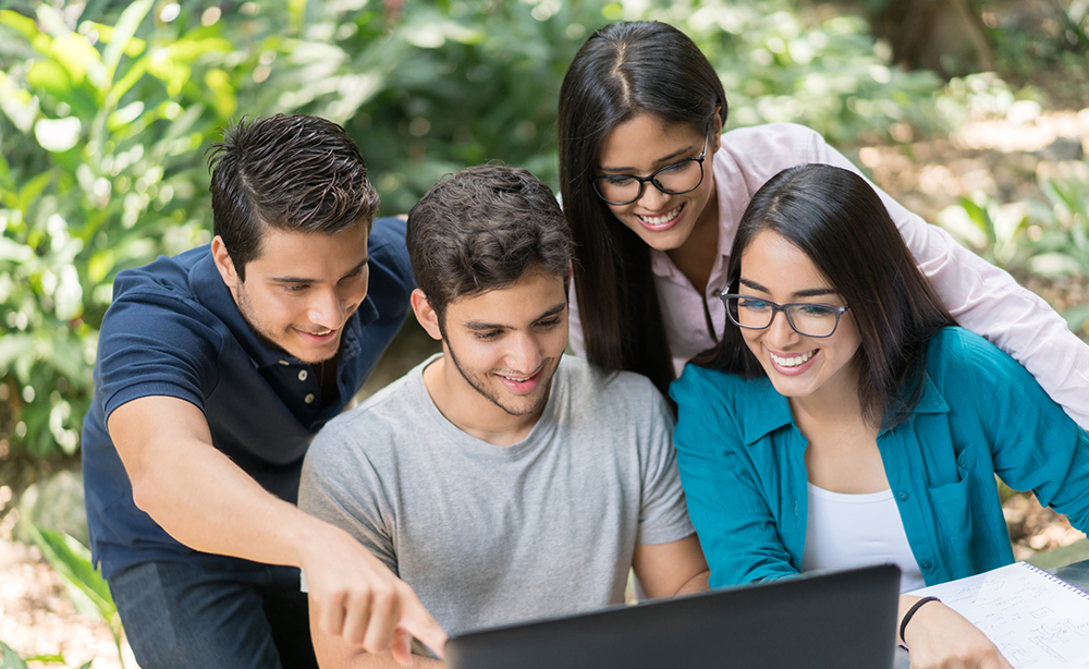 EDU-Students-Smiling-Looking-at-Laptop-Outside-TY EDU-Students-Smiling-Looking-at-Laptop-Outside-TY