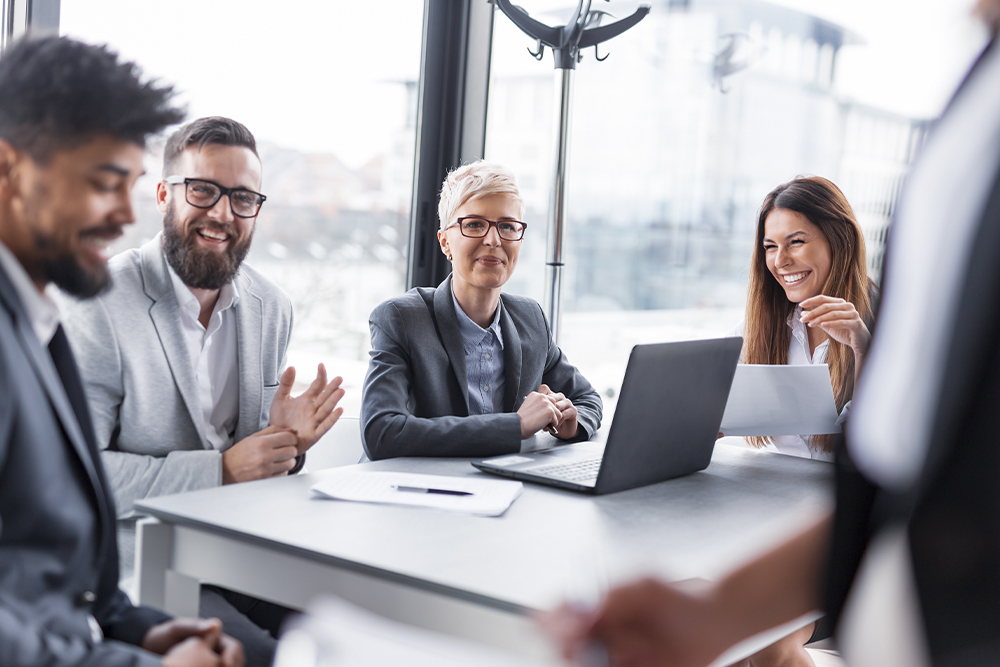 business-team-table-smiling business-team-table-smiling
