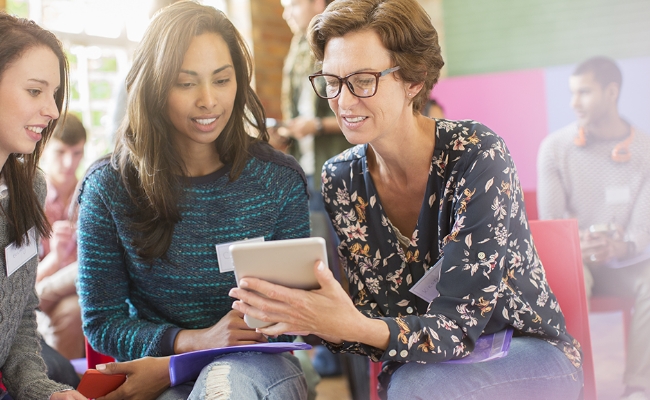 females-looking-at-mobile-device females-looking-at-mobile-device