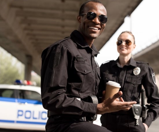 male-female-police-officers-smiling male-female-police-officers-smiling