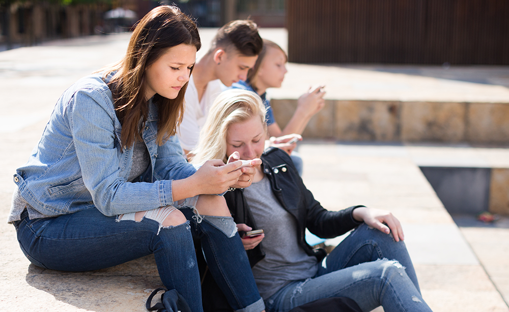 Students playing with smartphones-TY