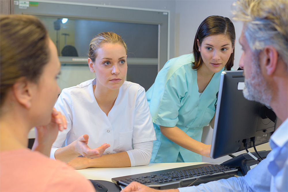 hospital-staff-tense-discussion-with-female-male